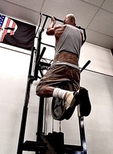 At 64 years young, Doug Holland, regularly performs super slow chin-ups with heavy weight!