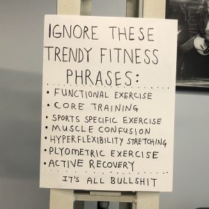 A sign in Doug Holland's gym that lists fitness trends that clients should ignore, such as "functional exercise" and "active recovery".